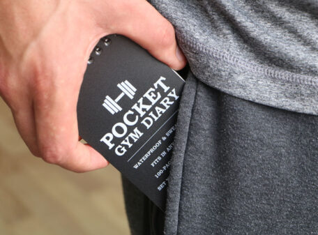 Slipping the Pocket Gym Diary into a trouser pocket.