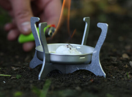 Using a lighter to ignite the Exogel Camping Stove Gel Fuel in a Phantom lightweight stove.