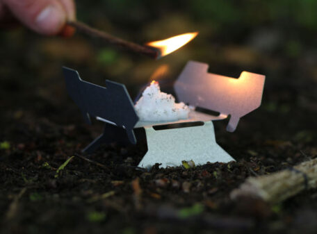 Igniting the Exogel Camping Stove Gel Fuel with a lit piece of waxed jute, during a woodland hike.