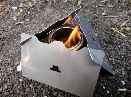 The Stealth Stove being used as a windshield / pot stand for a Trangia spirit burner.