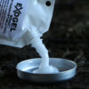 The lid of the Phantom Spillproof Alcohol Burner, being filled with some Exogel fuel from a pouch.