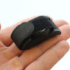 The PlusBeam neatly folded up on itself, looking very compact perched on a hand.