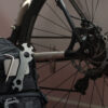 The Mag Patch affixed with hook and loop to a small backpack, being used to hold bike tools for maintenance while cycling.