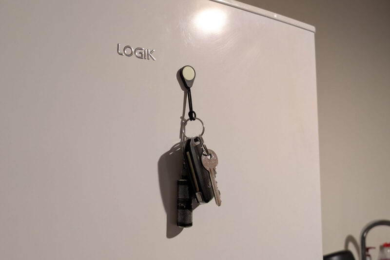 A Magnetag being used to hang a bunch of keys from a fridge.