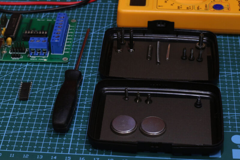 The Magnetic Pocket Case being used for storing batteries, electrical and electronic components and other parts for a hobby project.