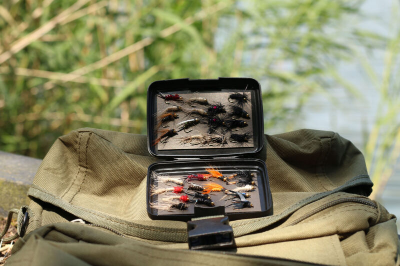 The Magnetic Pocket Case being used for storing fish hooks and trout fly lures while out fishing.