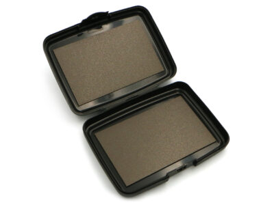 The Magnetic Pocket Case, opened up to show the two neodymium magnet surfaces, on a plain white background.