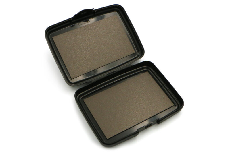 The Magnetic Pocket Case, opened up to show the two neodymium magnet surfaces, on a plain white background.
