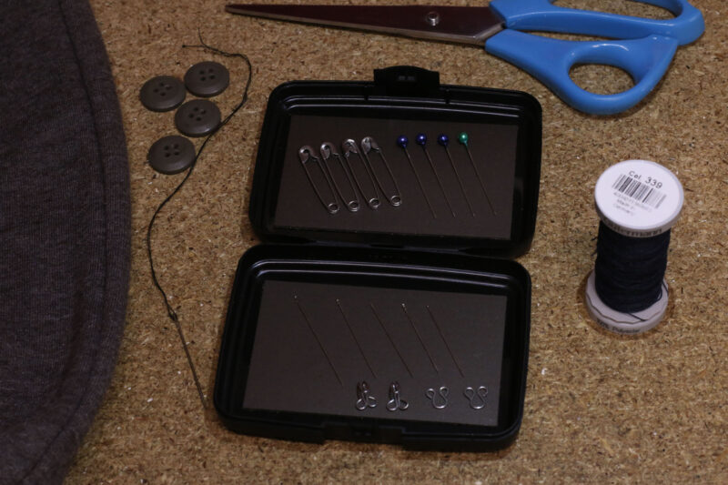The Magnetic Pocket Case being used for storing sewing needles and pins.