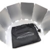 The Camping Stove Windshield shown opened out into a semicircle, with its black storage pouch, on a plain white background.