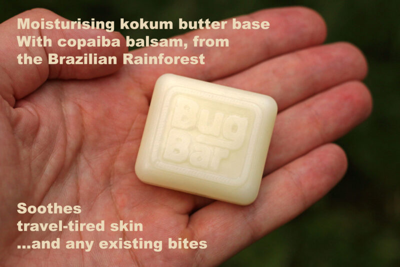 Bug Bar Solid Insect Repellent Bar, held in the palm of a hand, with captions mentioning its moisturising and skin soothing properties.