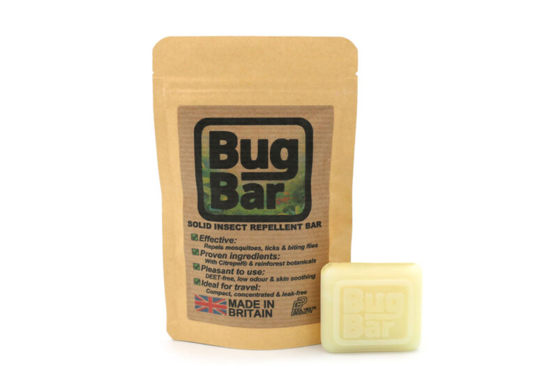 Bug Bar Solid Insect Repellent Bar, next to its storage pouch, on a plain white background.